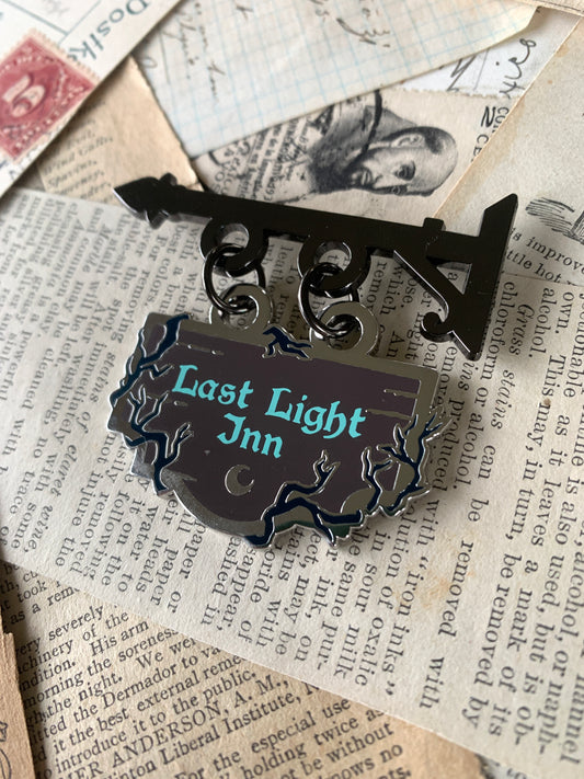 Last Light Inn shop sign enamel pin