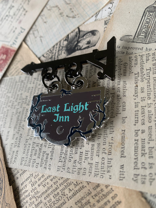 Last Light Inn shop sign enamel pin